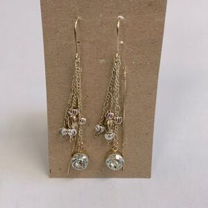 Long gold and silver tone earrings